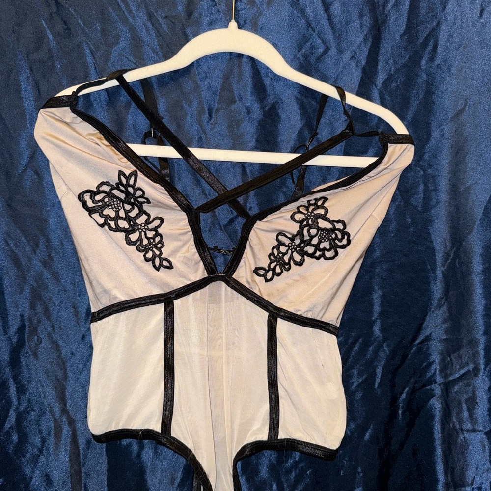 Elegant Black and Cream Bodysuit with Floral Embroidery